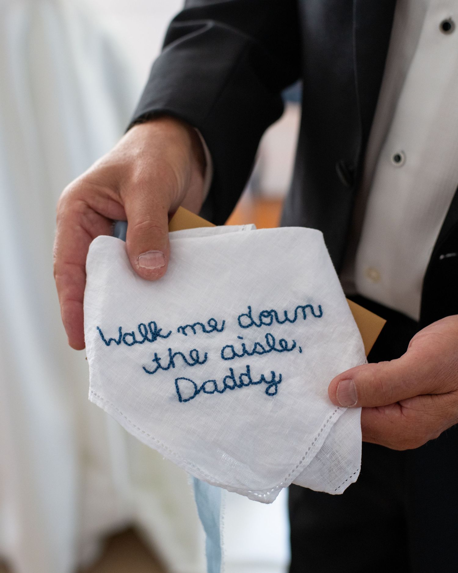 Embroidered handkerchief reading Walk me down the aisle Daddy, a heartfelt wedding gift from bride to father.