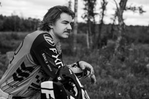 Black and white portrait of motocross rider in FXR gear.