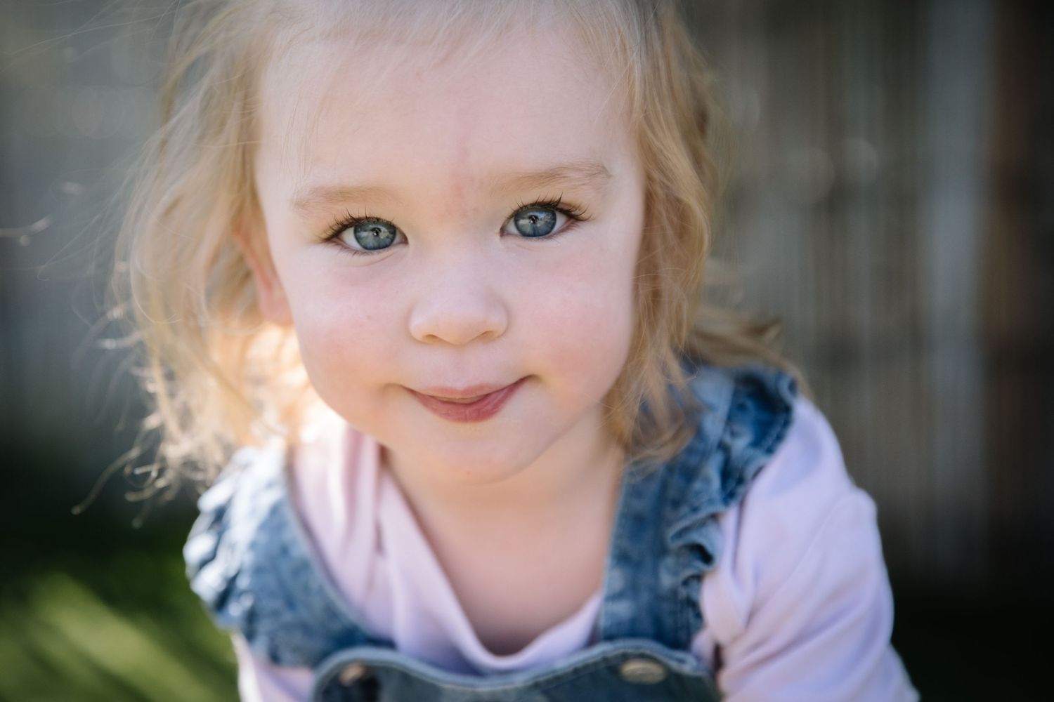Close up portrait with soft natural lighting and bokeh background.