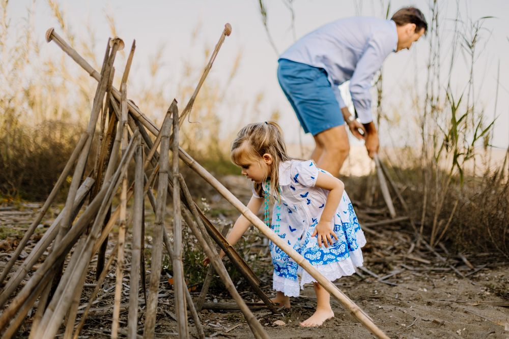 Building a bamboo tipi tent with Dad at Marbella photo session.