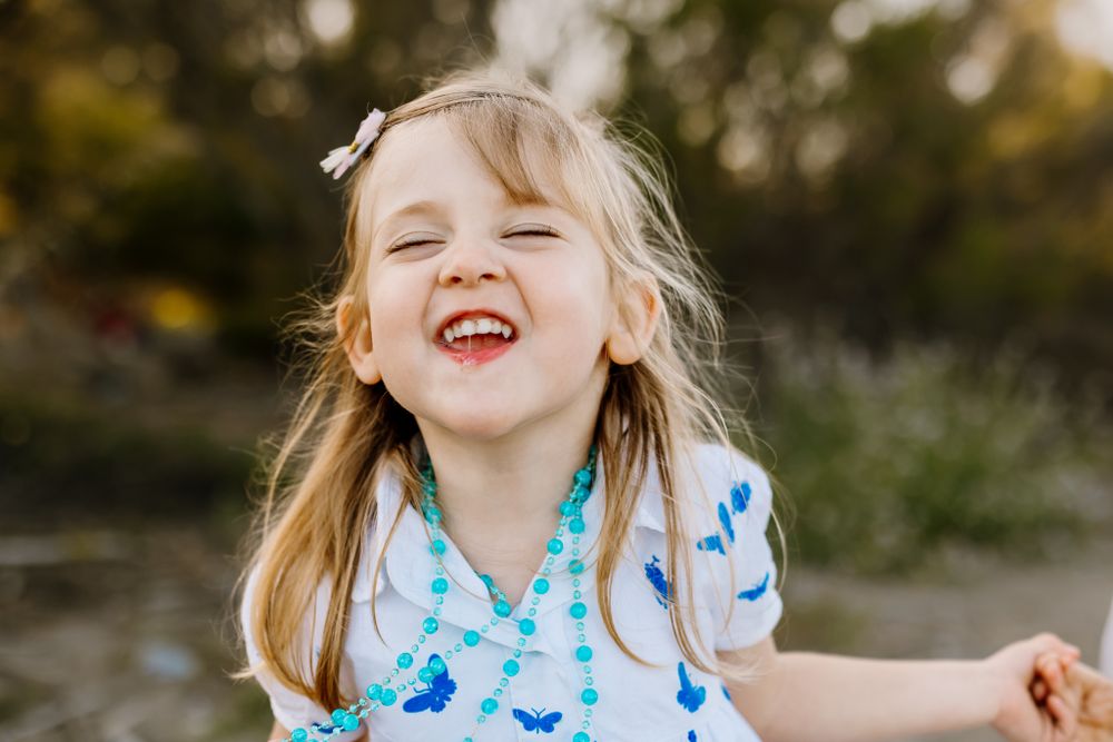 Sofia make faces to the camera at marbella family photo session.