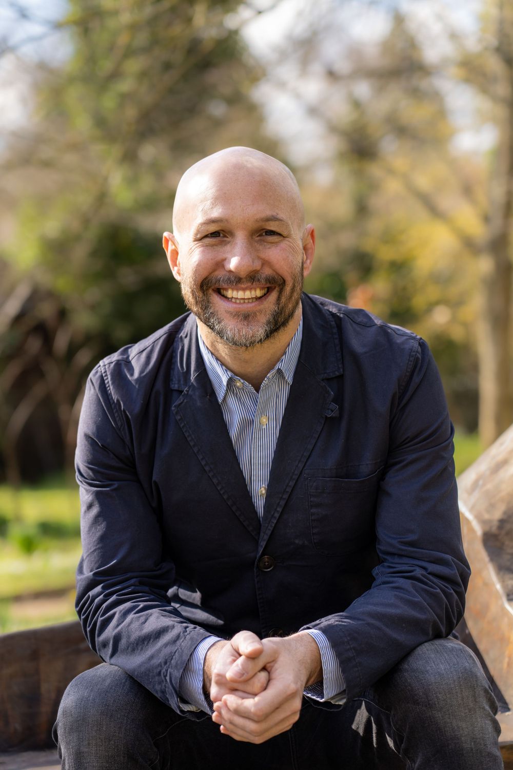 Professional headshots series showing warm expressions in outdoor setting.
