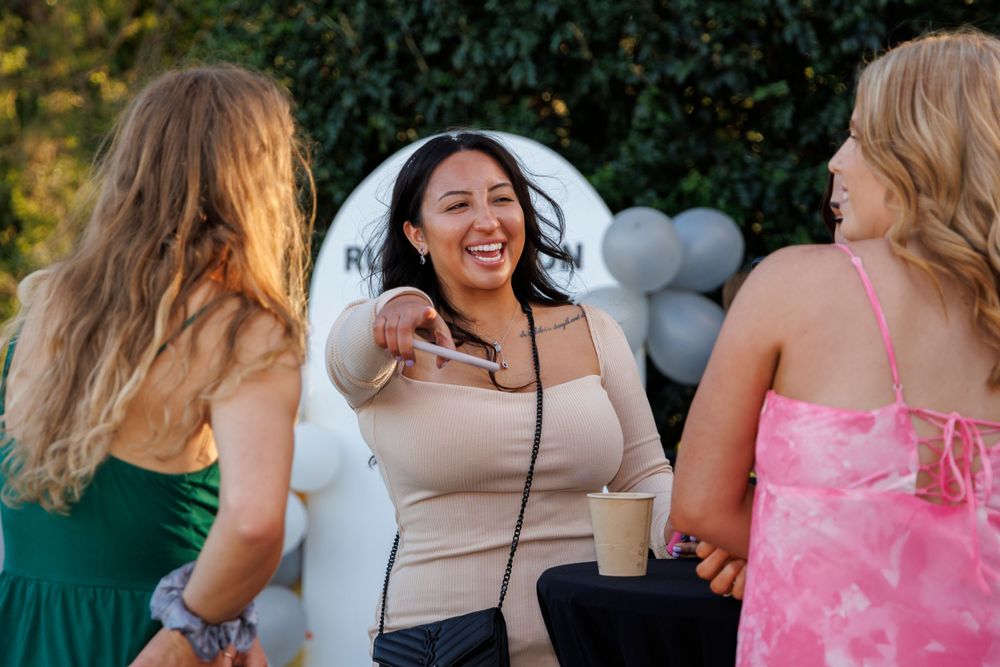 Ladies laughing and enjoying ladies day event at local rugby club captured by brisbane events photographer