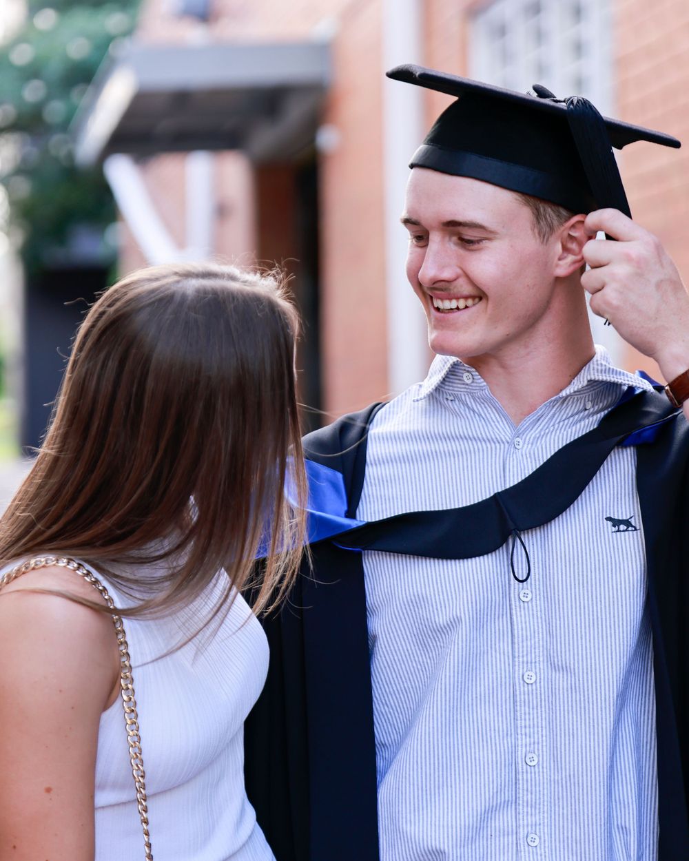 University graduate celebrates receiving certificate captured in brisbane by photographer rachel wright images