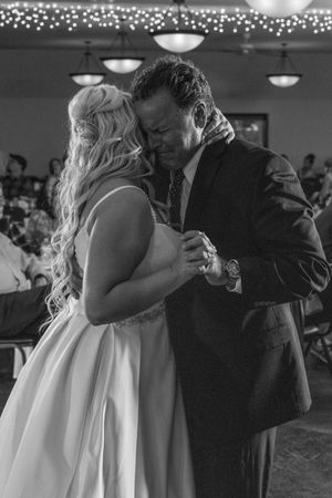 A black and white series of wedding dance photos showing intimate moments between a couple in formal attire.