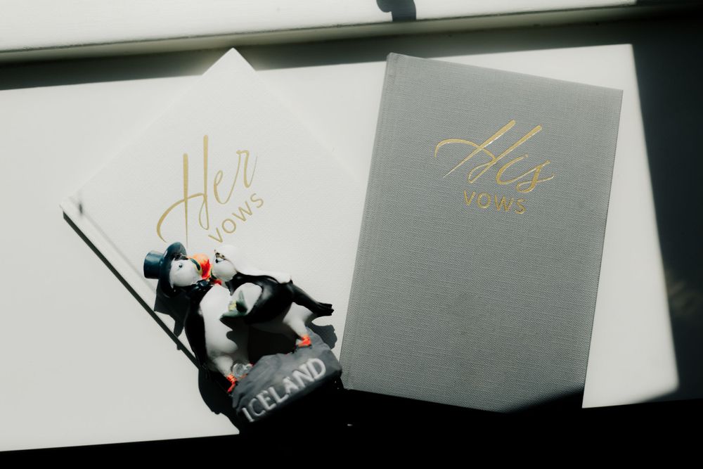 Artistic shadow play with wedding invitations and decorative elements.