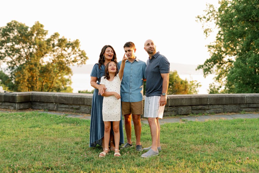 A summer evening portrait session near a stone wall.