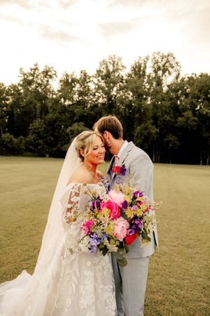 Bride and groom share a romantic kiss at Wrightsville manor in Wilmington, NC.