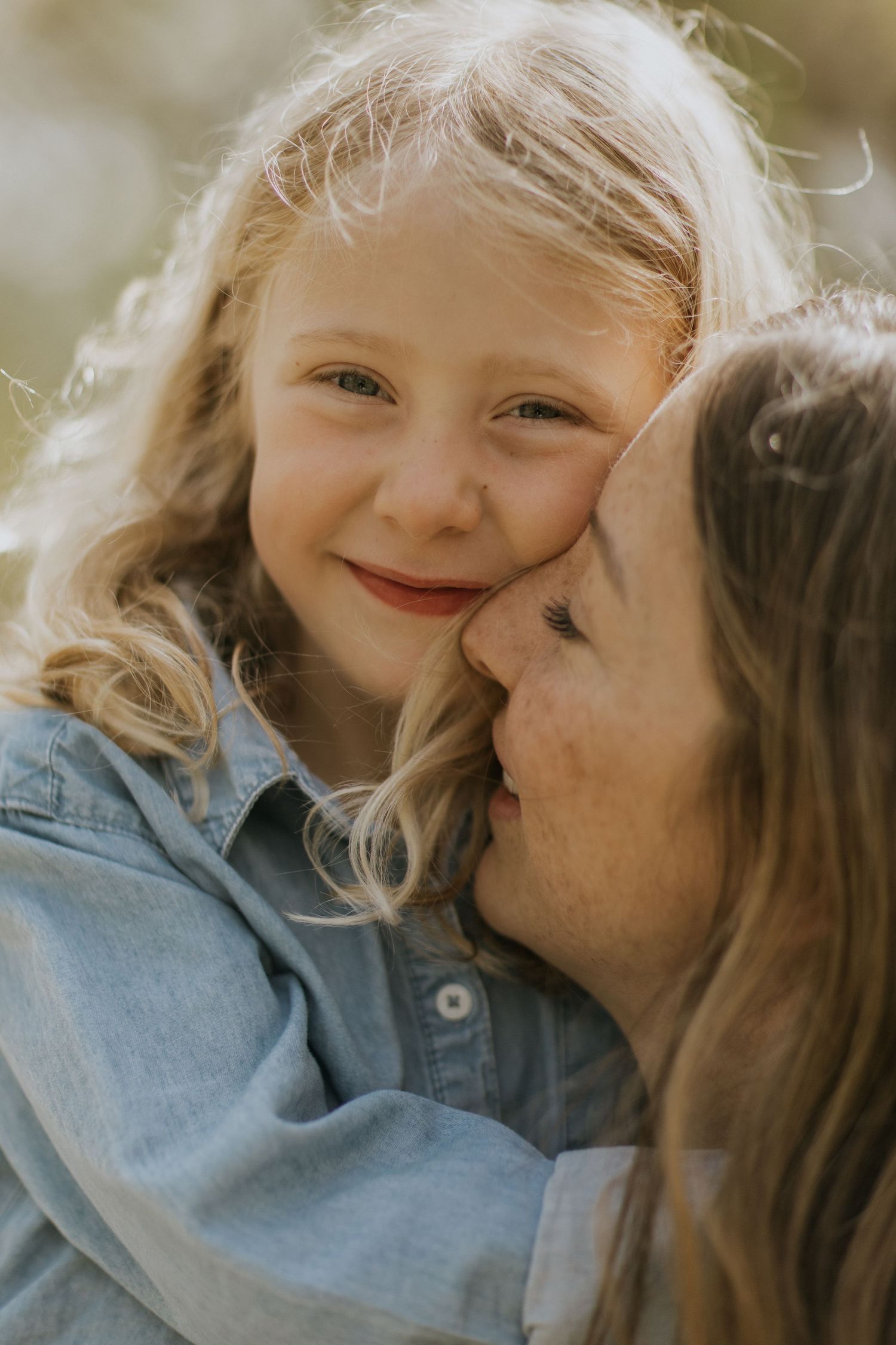 Sweet candid moments of affection shared during an outdoor spring photoshoot.