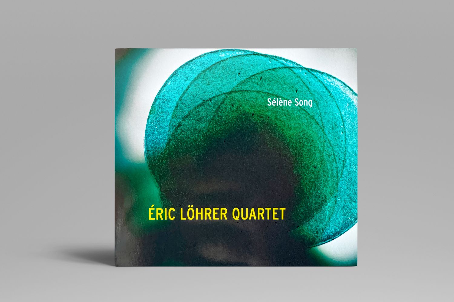 Album cover for Eric Lohrer Quartet featuring abstract turquoise spiral design.