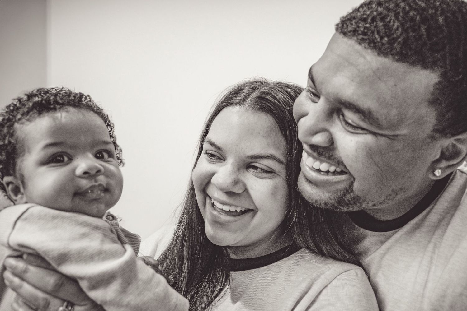 Black and white portrait of happy family sharing joyful moment together.