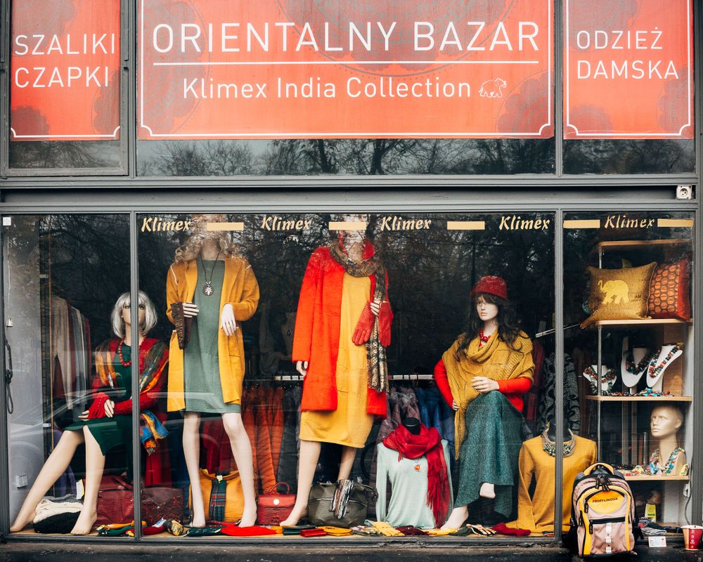 Colorful storefront display of an oriental bazaar showing clothing and accessories.