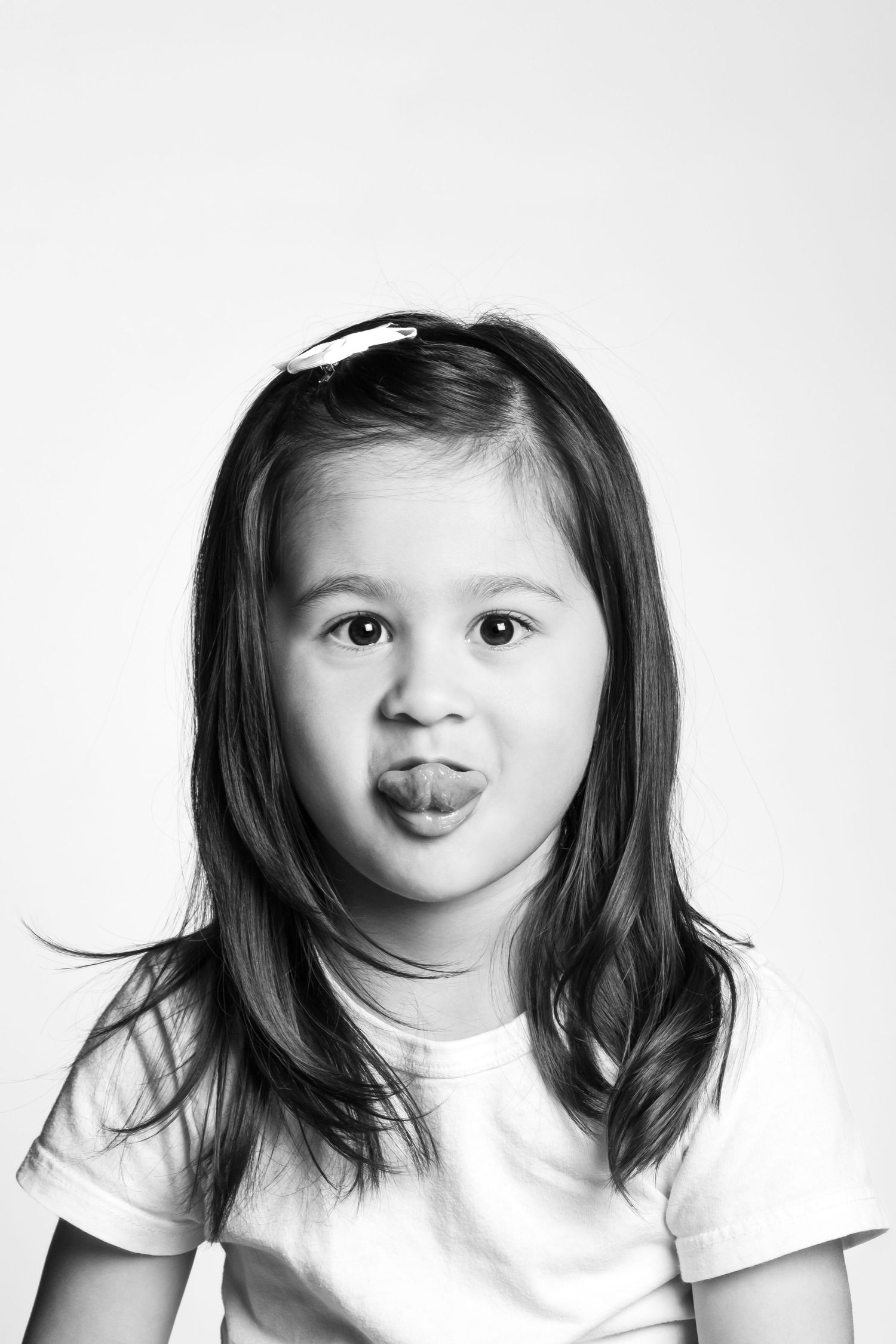 Series of playful expressions in black and white portrait style.