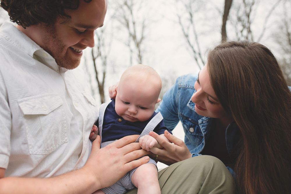 Intimate family moment outdoors with a small baby.
family photography