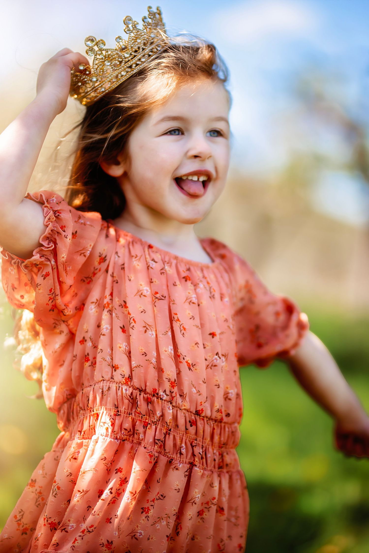 Young girl in pink dress holding her crown family photography Ellensburg, WA