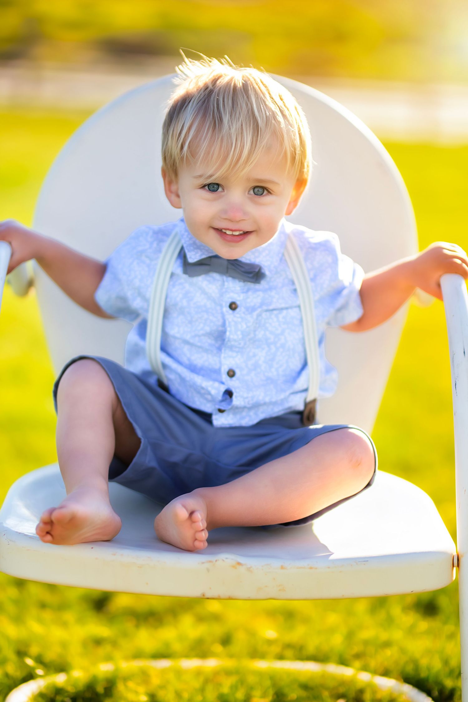 Boy sitting on a chair on a warm sunny evening during a family photography session in Ellensburg, WA