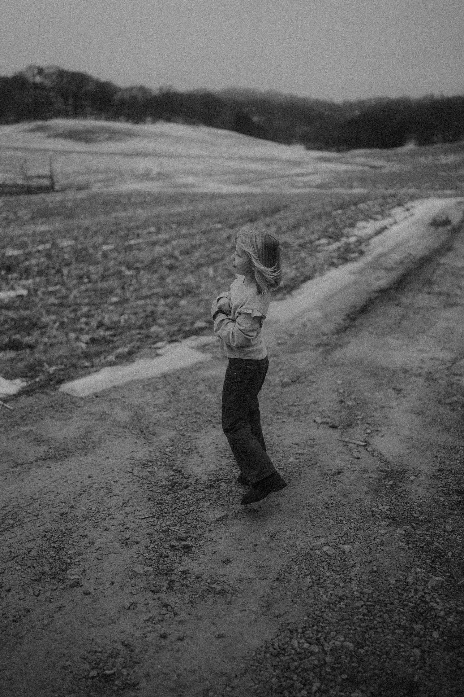 Wisconsin photographer capturing a little girl in an open field.