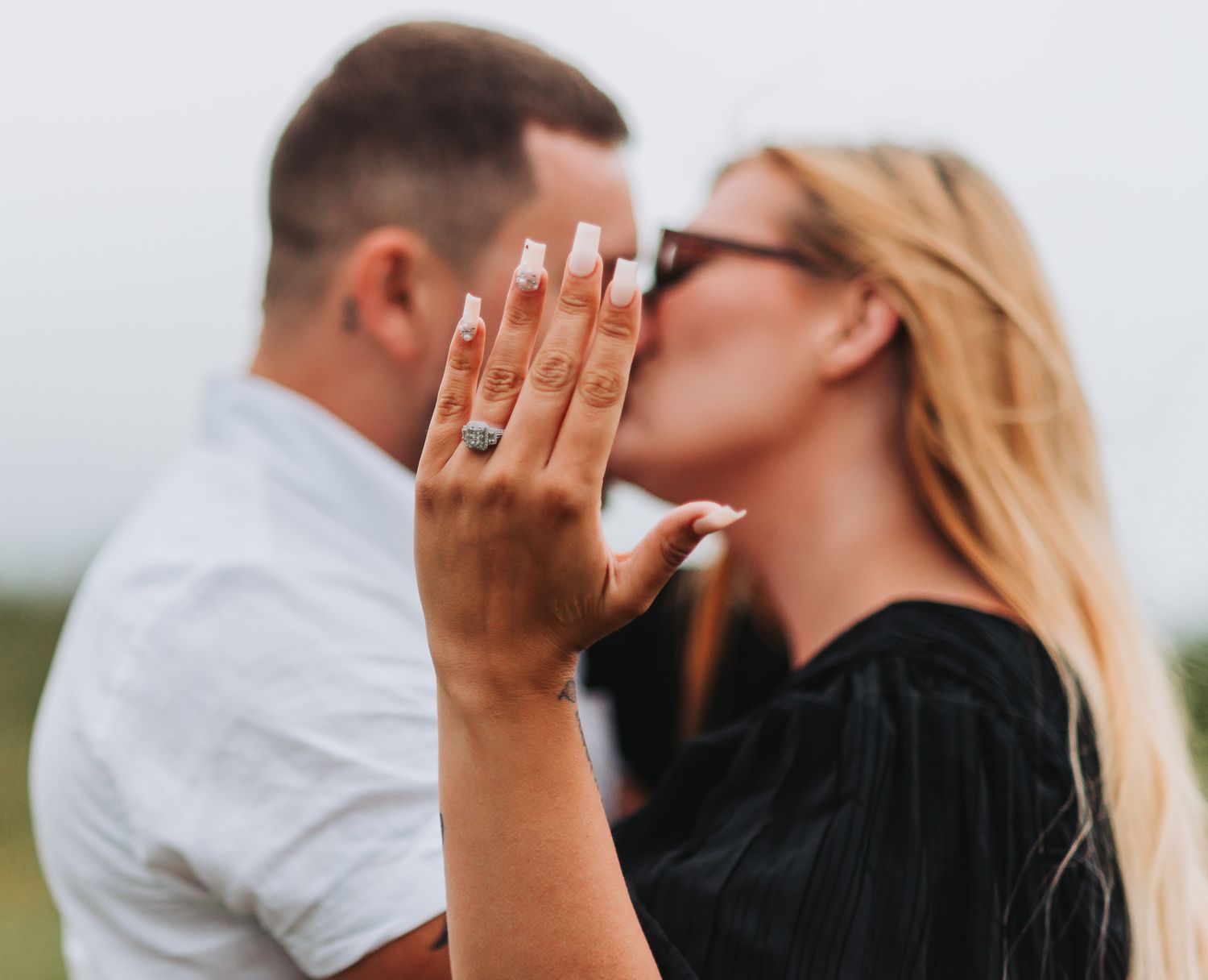 Intimate moments photographed against soft white background.