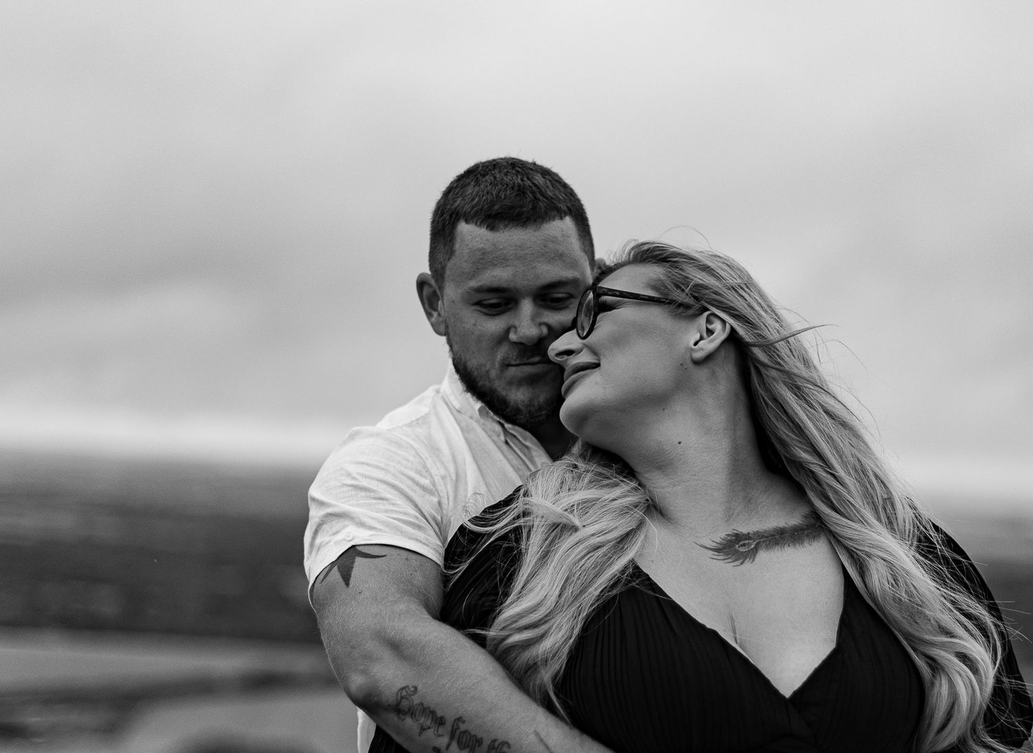 Romantic black and white portraits captured in natural outdoor setting.
