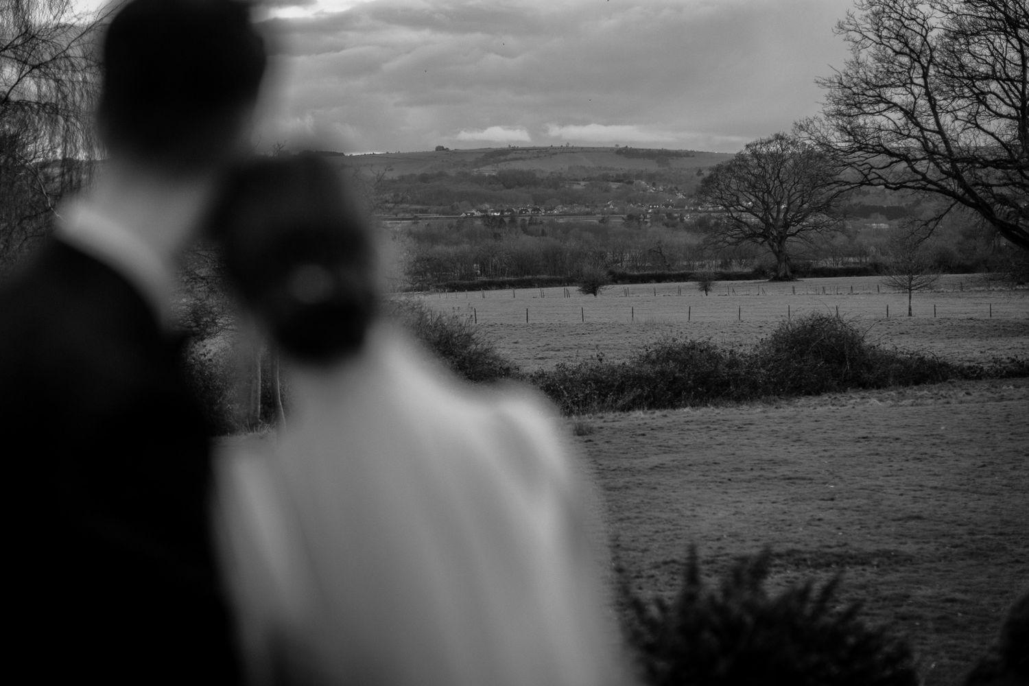 Scenic landscape views with silhouettes against a cloudy sky.