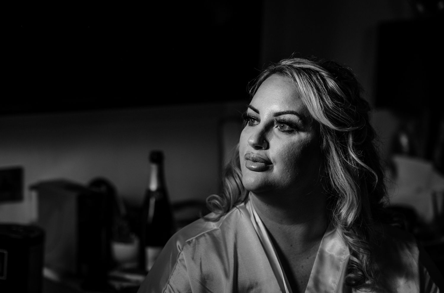 Dramatic black and white photo capturing intimate wedding moments.
