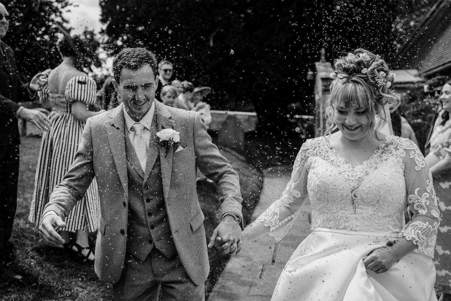 A sequence of candid wedding moments captured in black and white photography.