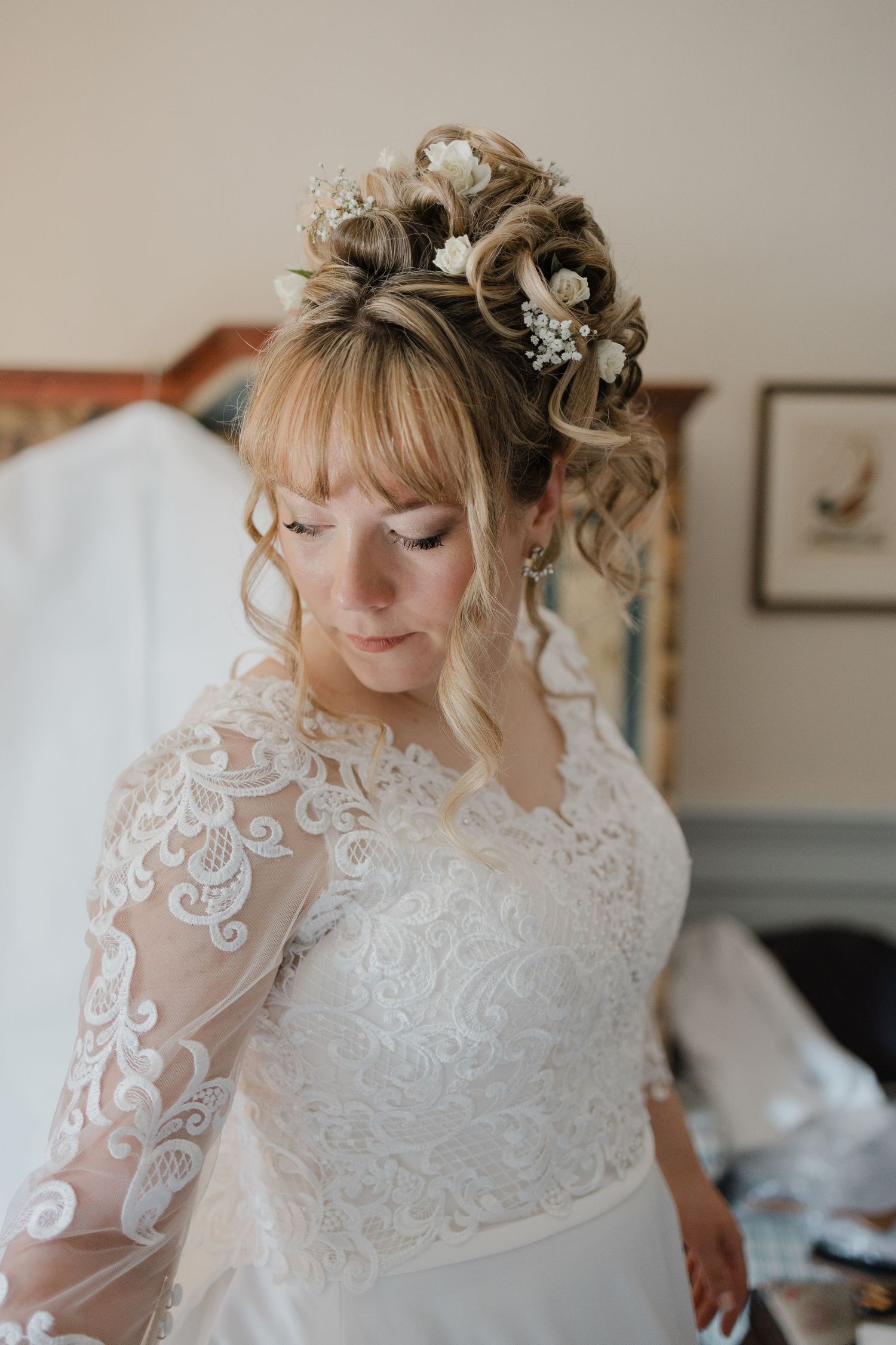 Close-up details of an elegant lace wedding dress with intricate embroidery patterns.