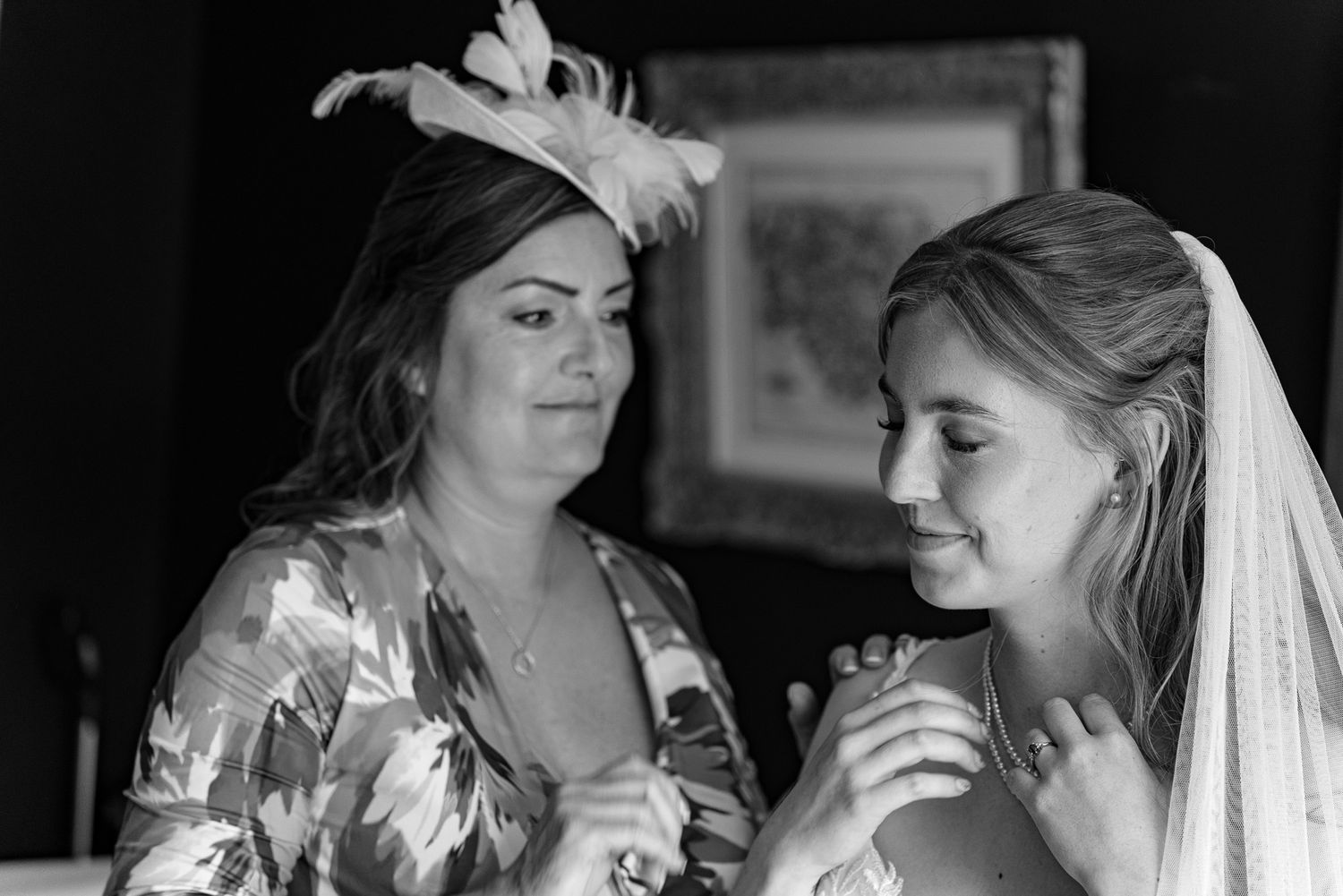 Black and white candid moments during bridal preparations.