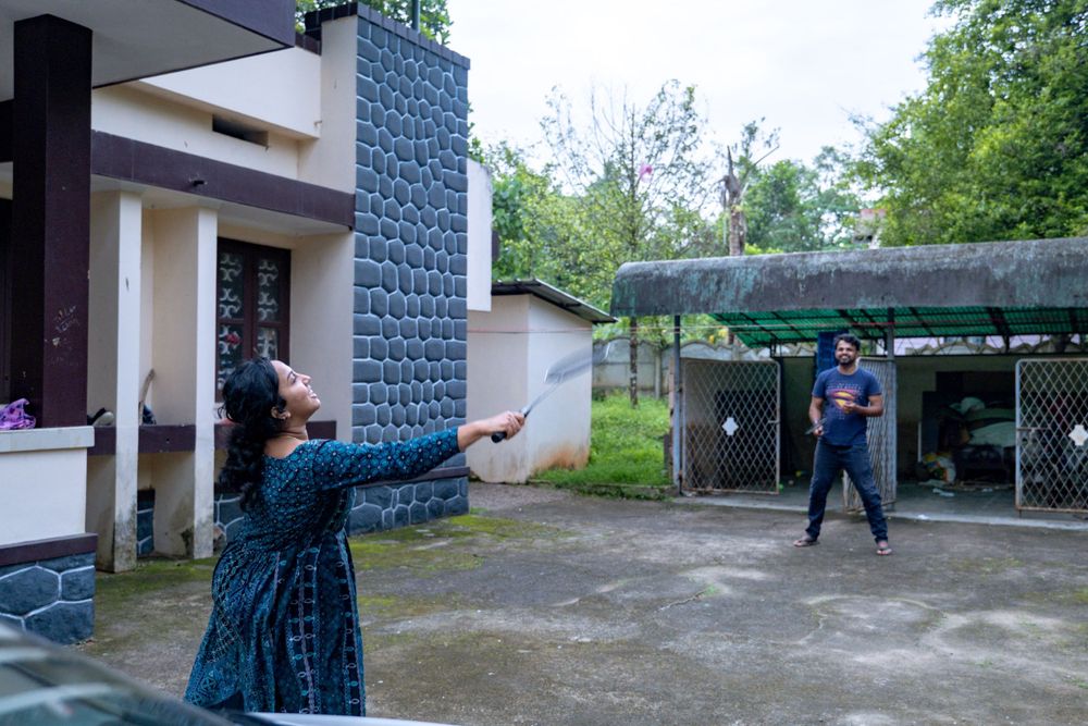 People playing outdoor games with doves at a residential property.