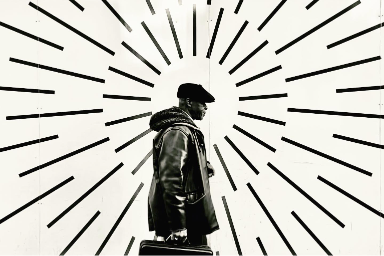Black and white illustration with radiating line patterns in a minimalist style.