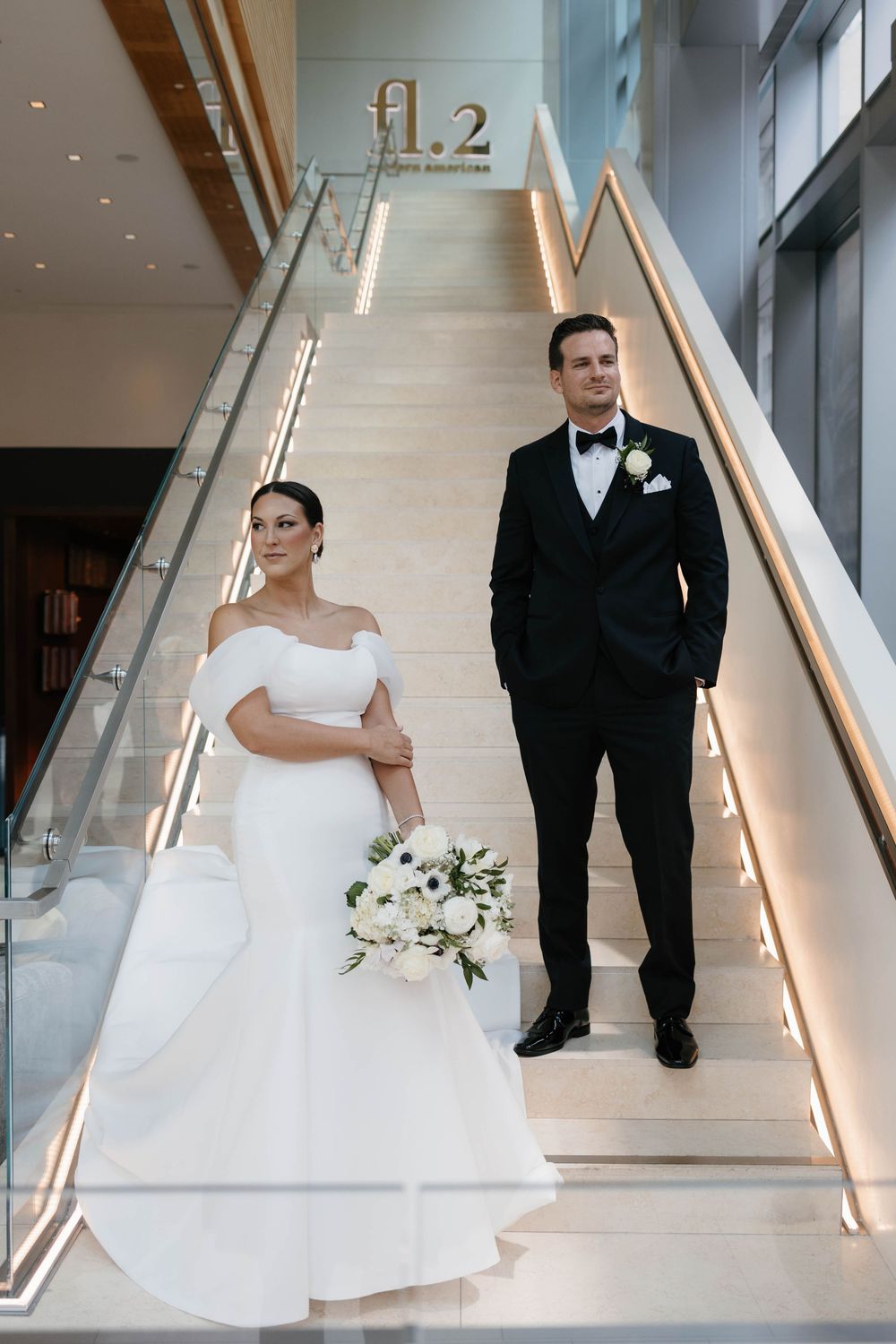 Bride and groom posed elegantly for an editorial-style wedding portrait