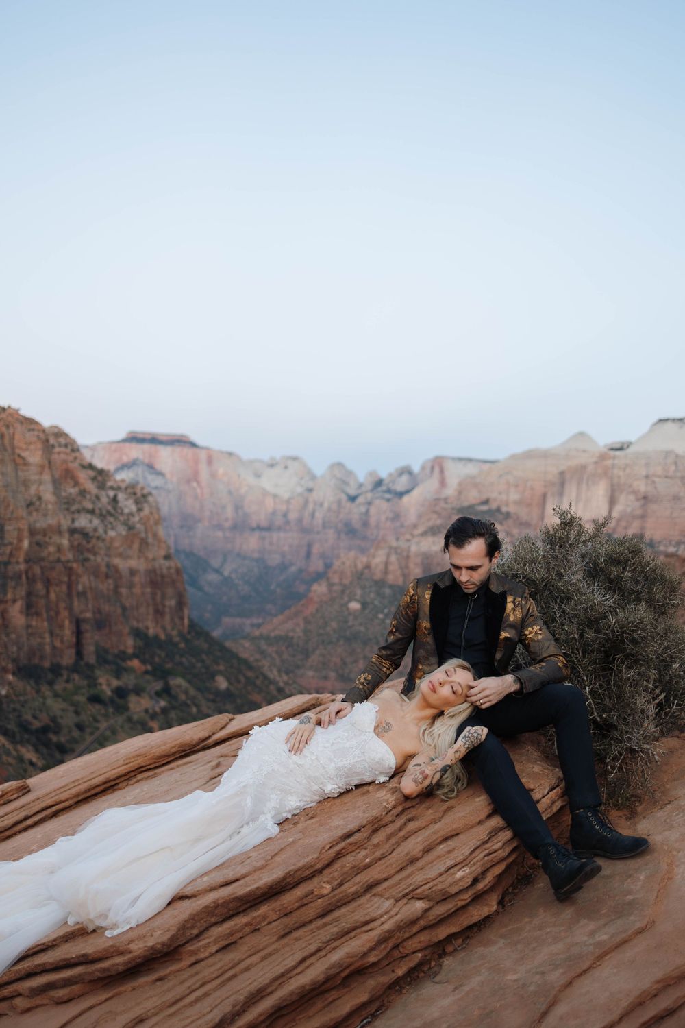 Couple embracing during Zion elopement at Canyon Overlook.