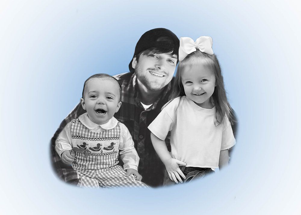 Black and white family portrait with young children against blue background.
