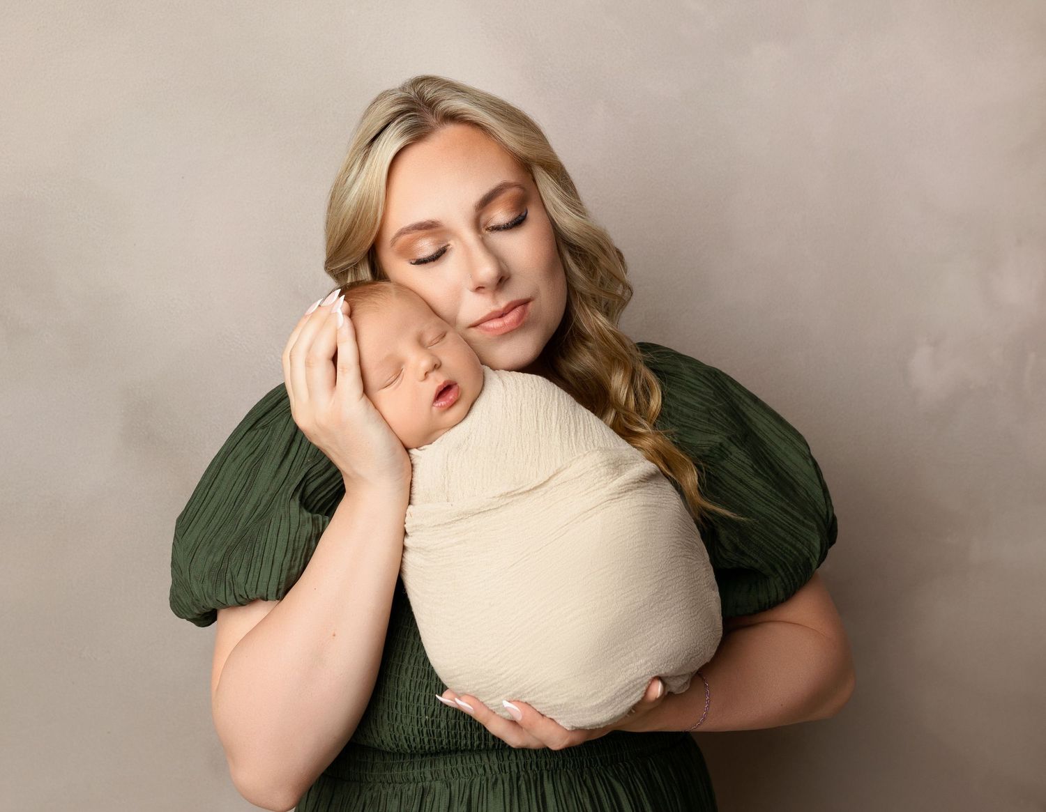 Mom with baby at a newborn session at Stephanie Ann Photography in New Hampshire