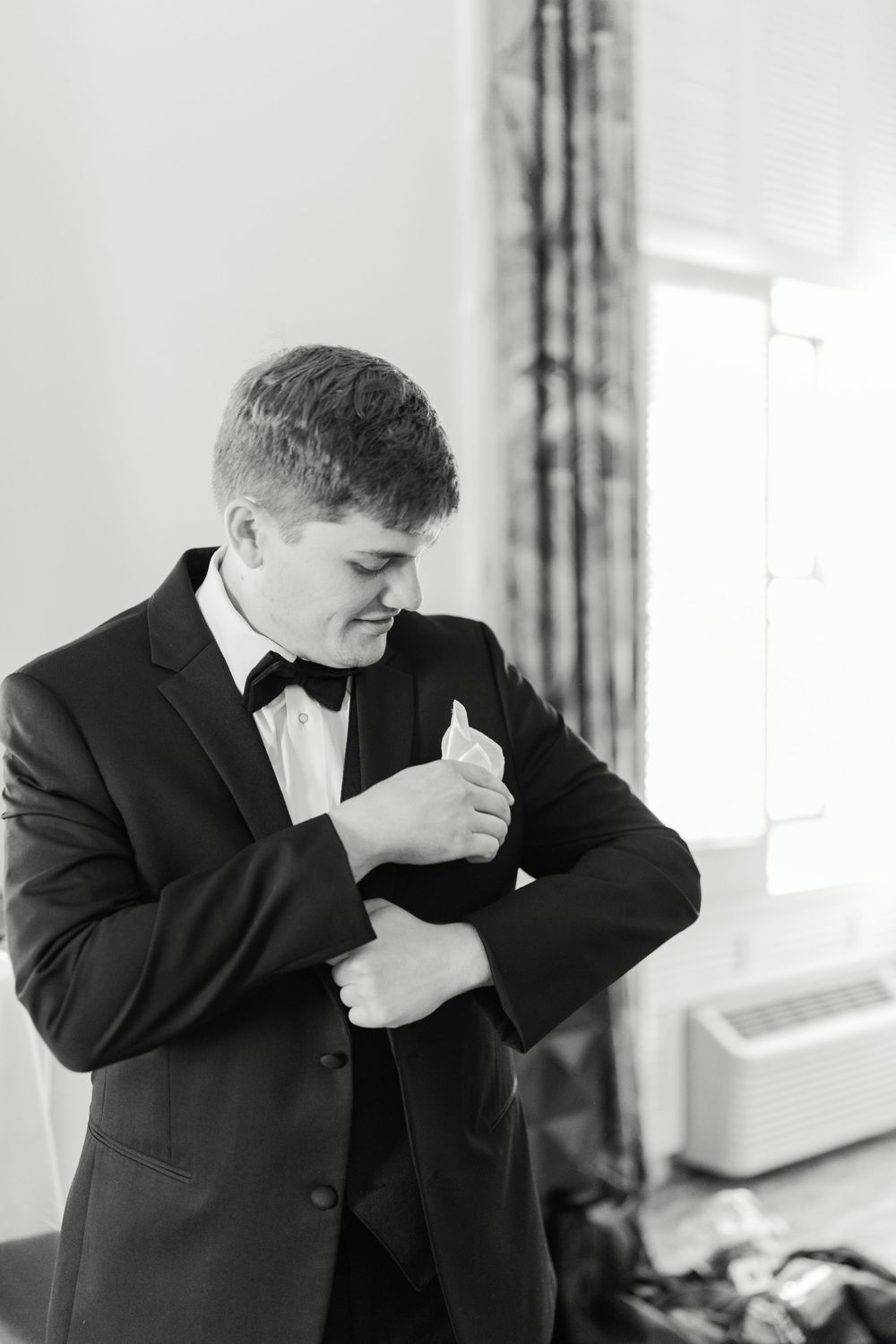 Black and white photo series showing funny expressions and silly reactions in formal attire.