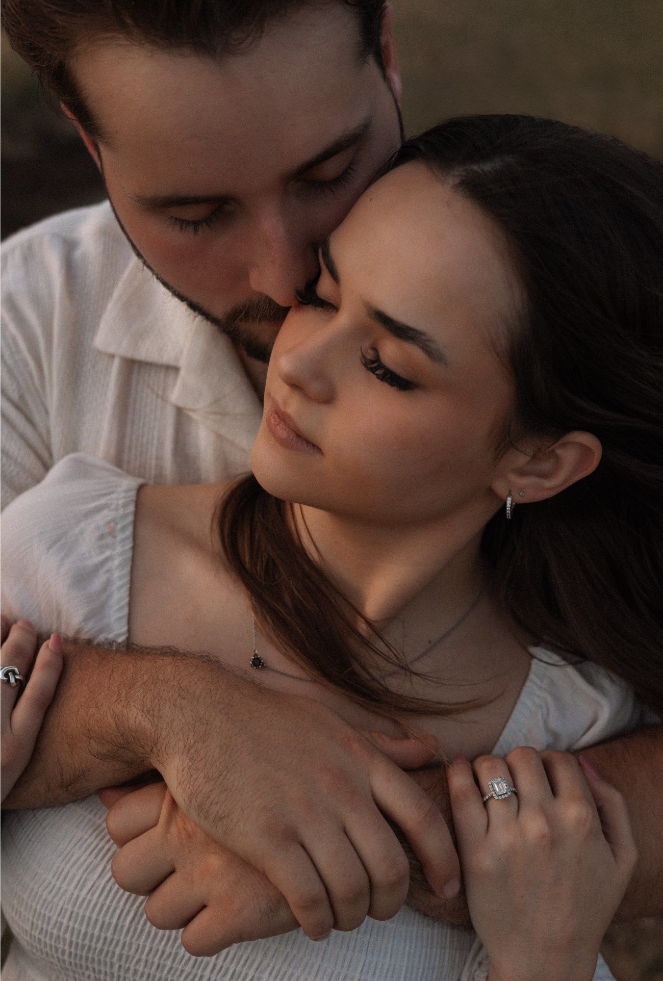 A romantic couple sharing intimate kisses in a series of tender black and white photographs.