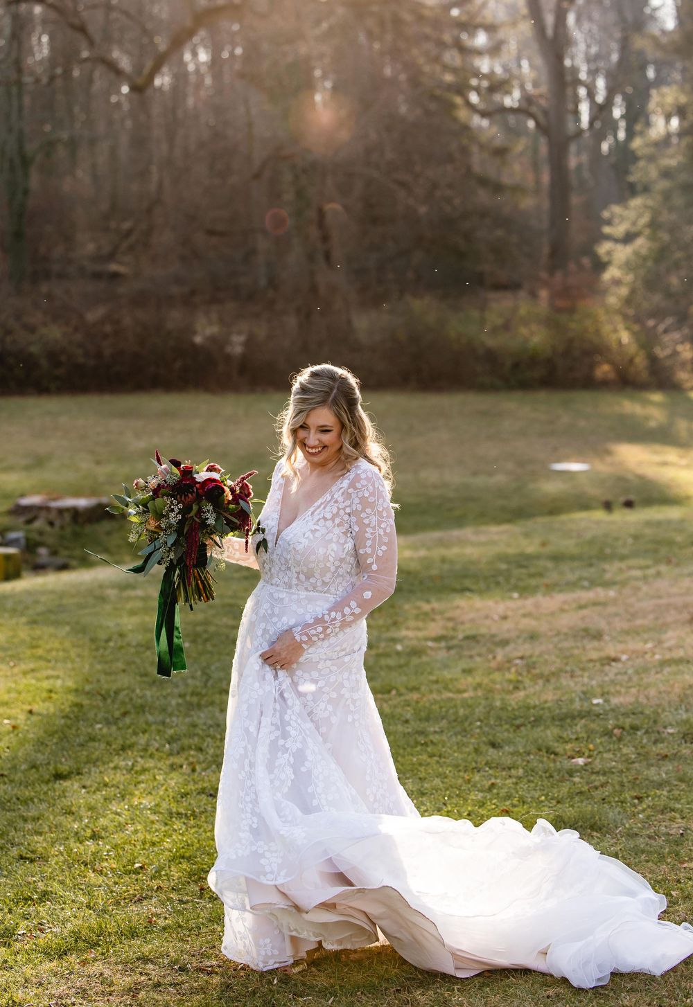 A flowing white wedding dress twirls gracefully in a sunlit outdoor setting. Michener Museum wedding.
