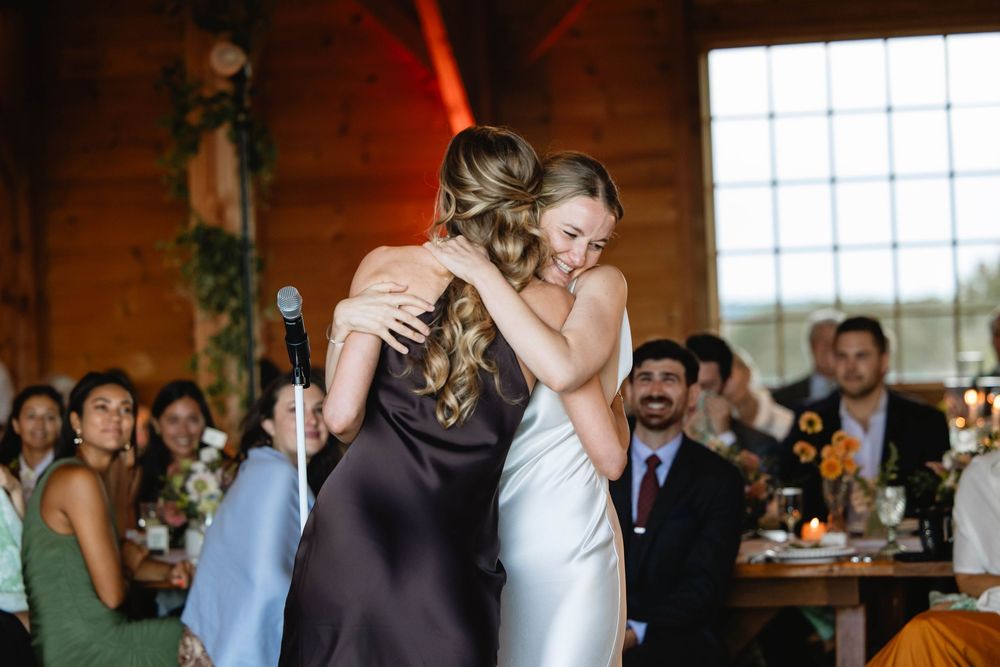 Sequence of dance moves during a wedding reception in a rustic wooden barn venue.