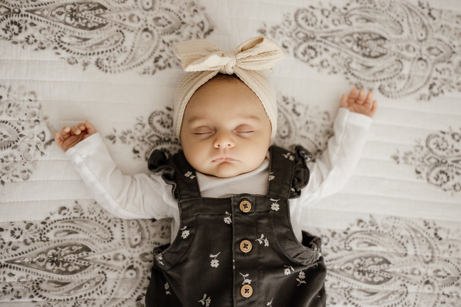 Precious newborn baby was photographed both asleep and awake at Bay Area in-home lifestyle photoshoot in San Jose