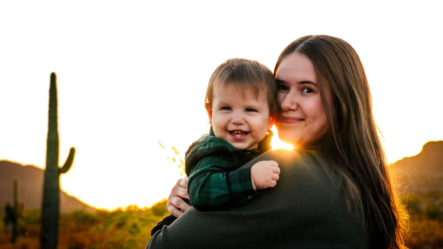 A mommy & me photography session with Samantha Stickroth Photography. The photo is in Queen Creek, AZ with a desert background.