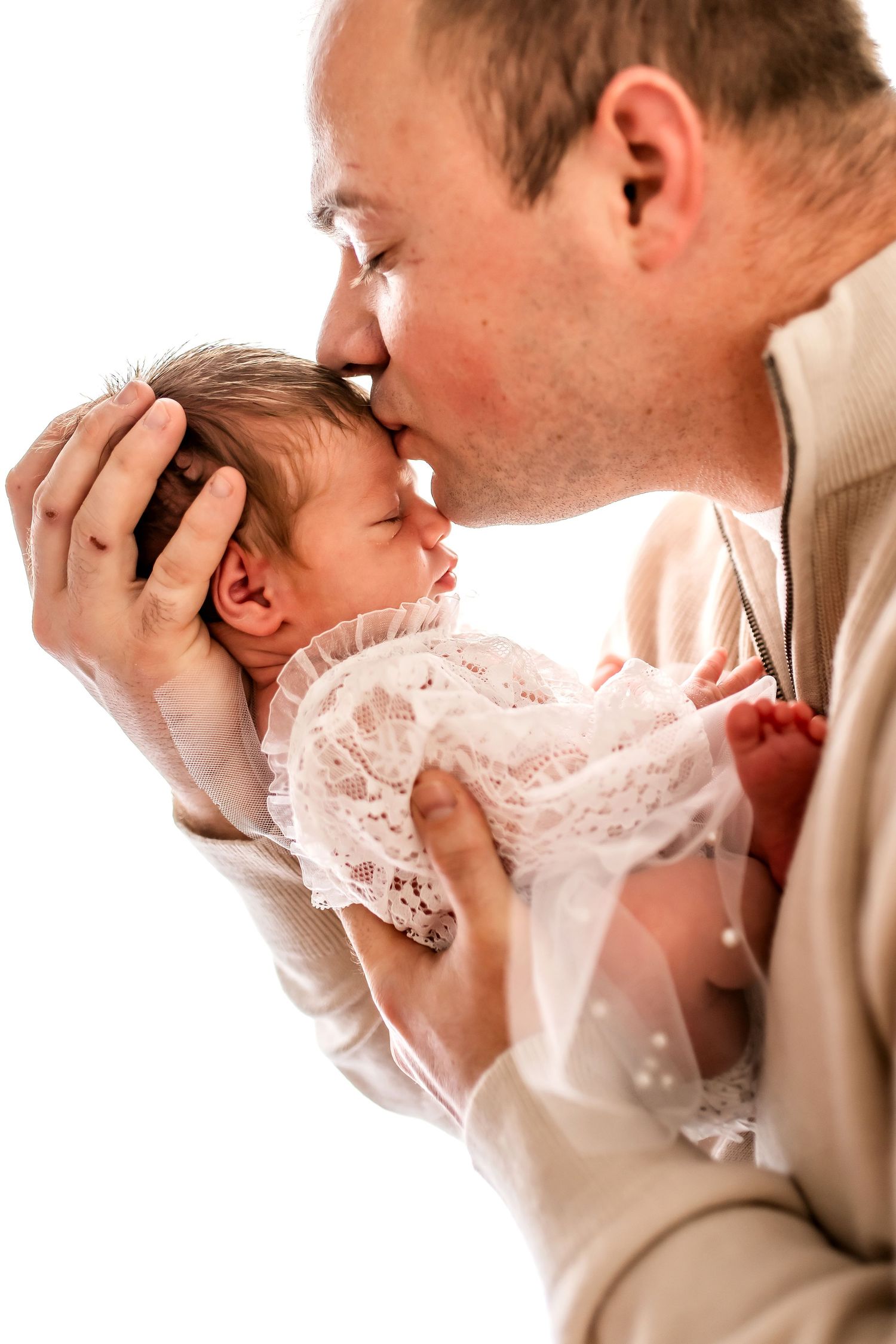 A tender moment shared between parent and child in cozy winter attire.
