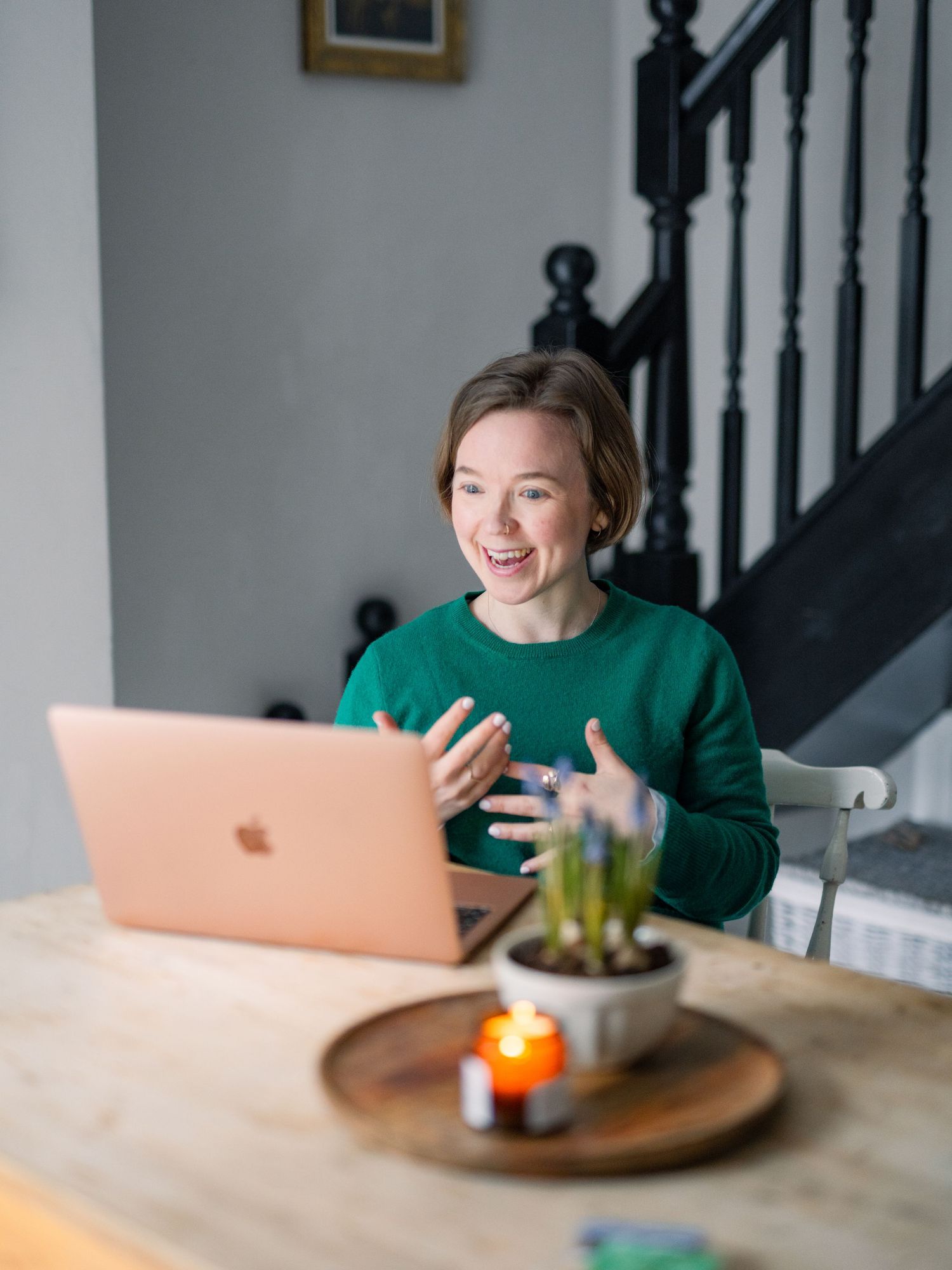 Headshot and branding image of woman in relaxed neutral home location