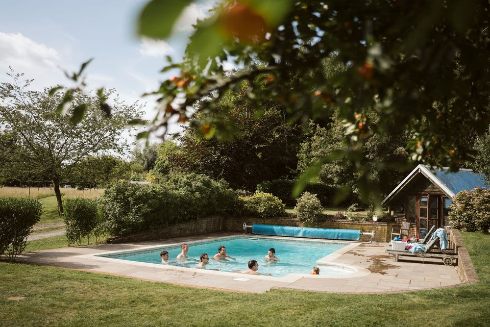 Wedding venue outdoor swimming pool on a summer wedding day in Surrey