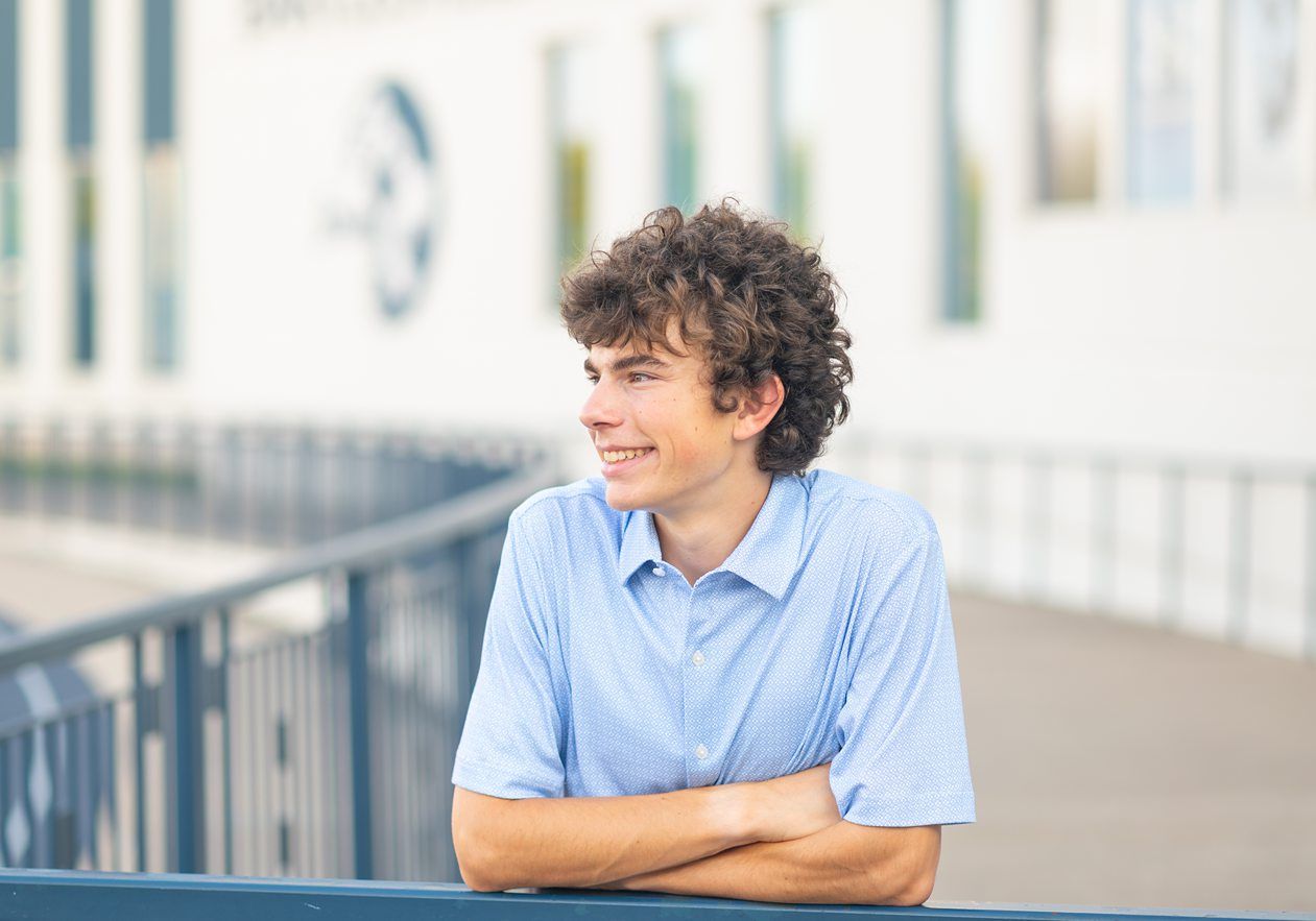 Senior Guy at Bartlesville High School BHS and Downtown by Bartlesville Senior Photographer Kristi Bray Photography