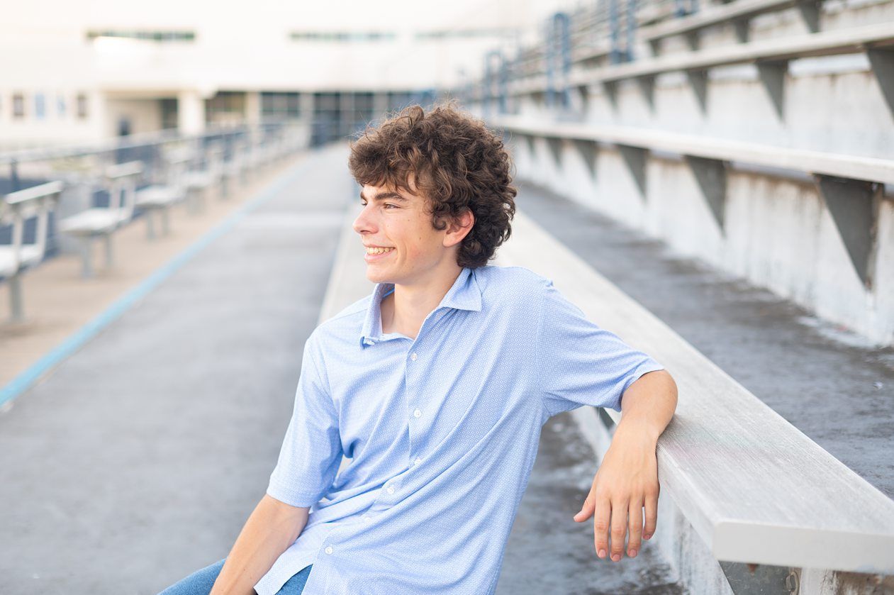 Senior Guy at Bartlesville High School BHS and Downtown by Bartlesville Senior Photographer Kristi Bray Photography