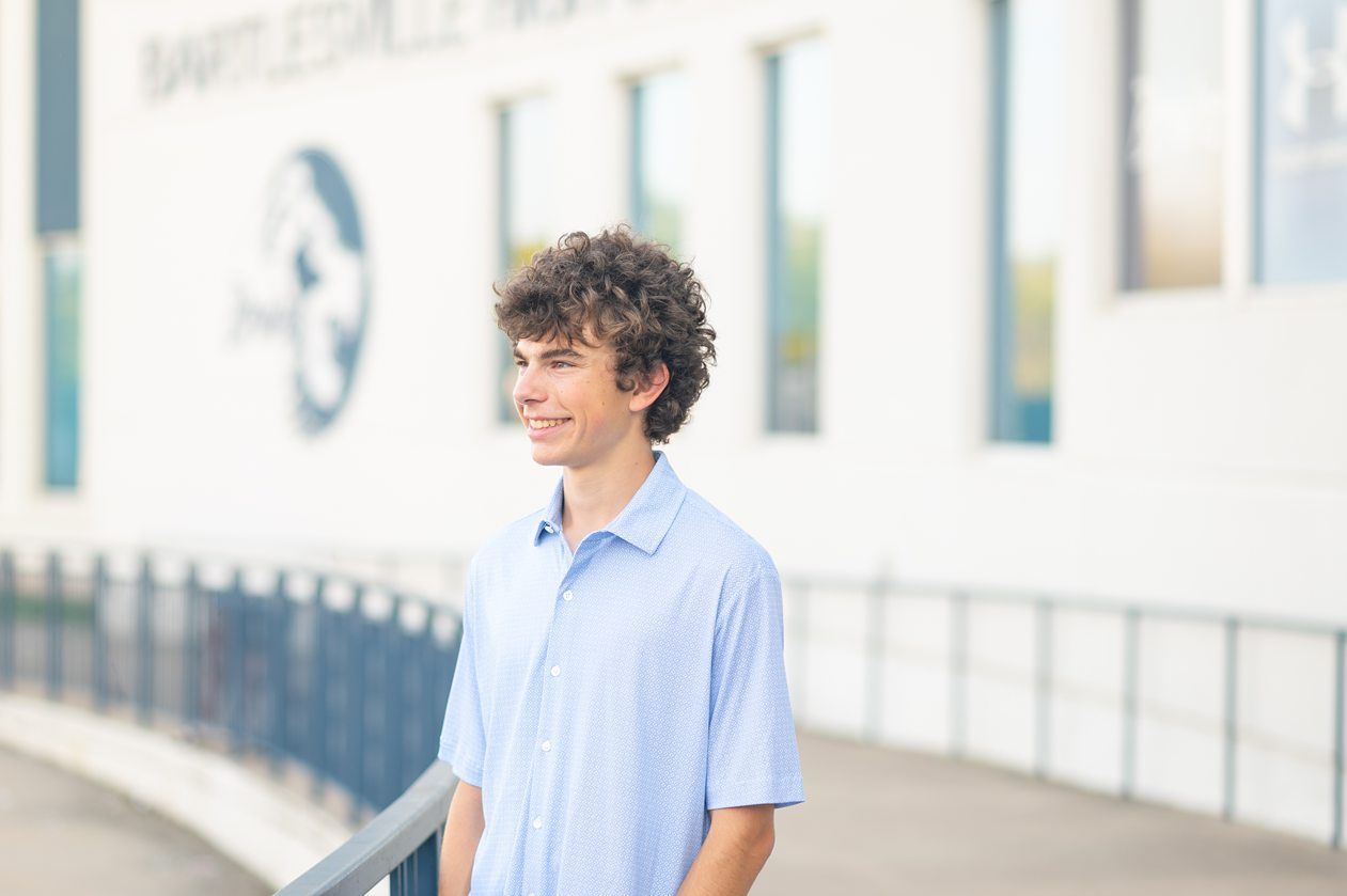 Senior Guy at Bartlesville High School BHS and Downtown by Bartlesville Senior Photographer Kristi Bray Photography