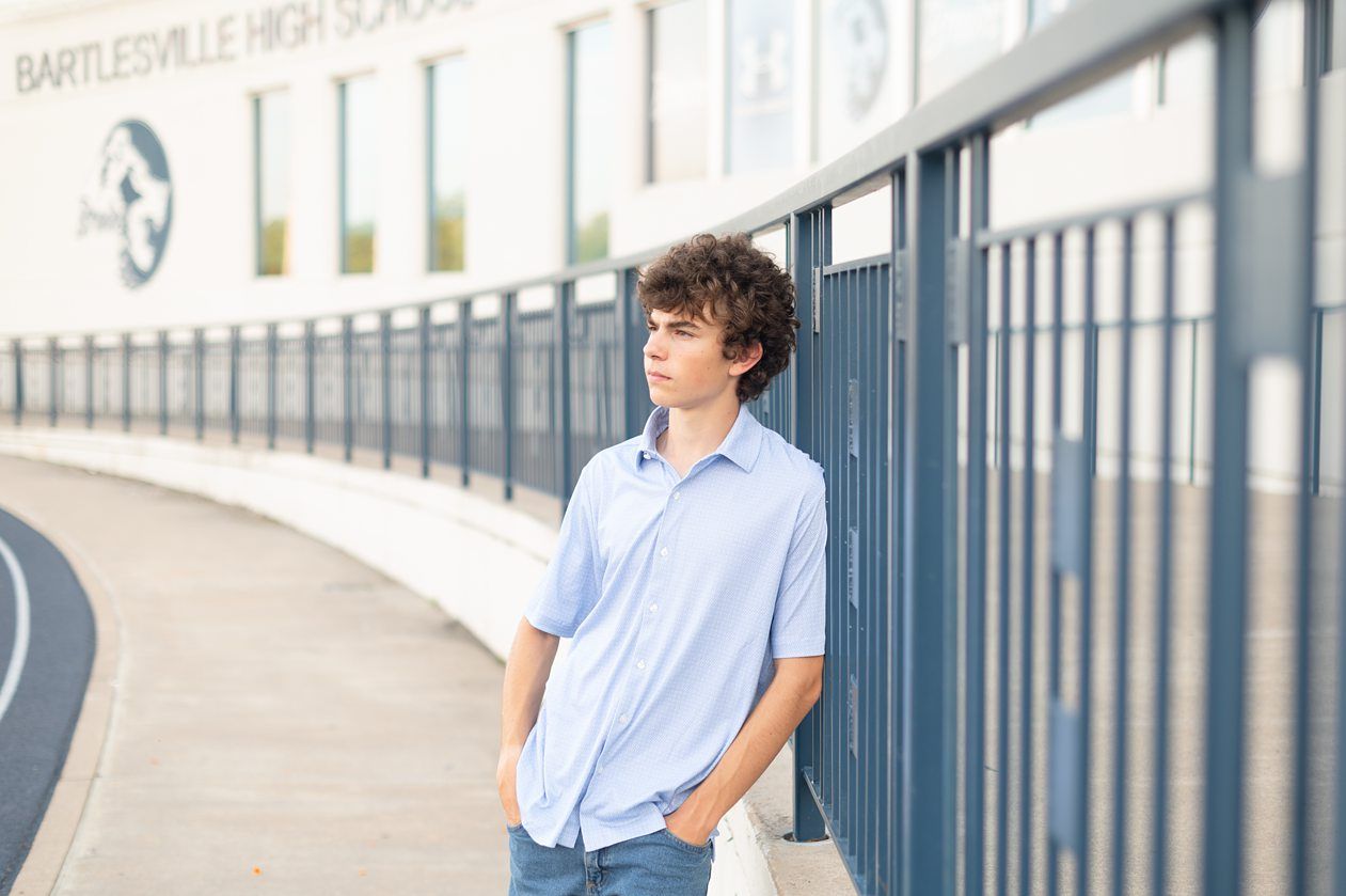 Senior Guy at Bartlesville High School BHS and Downtown by Bartlesville Senior Photographer Kristi Bray Photography