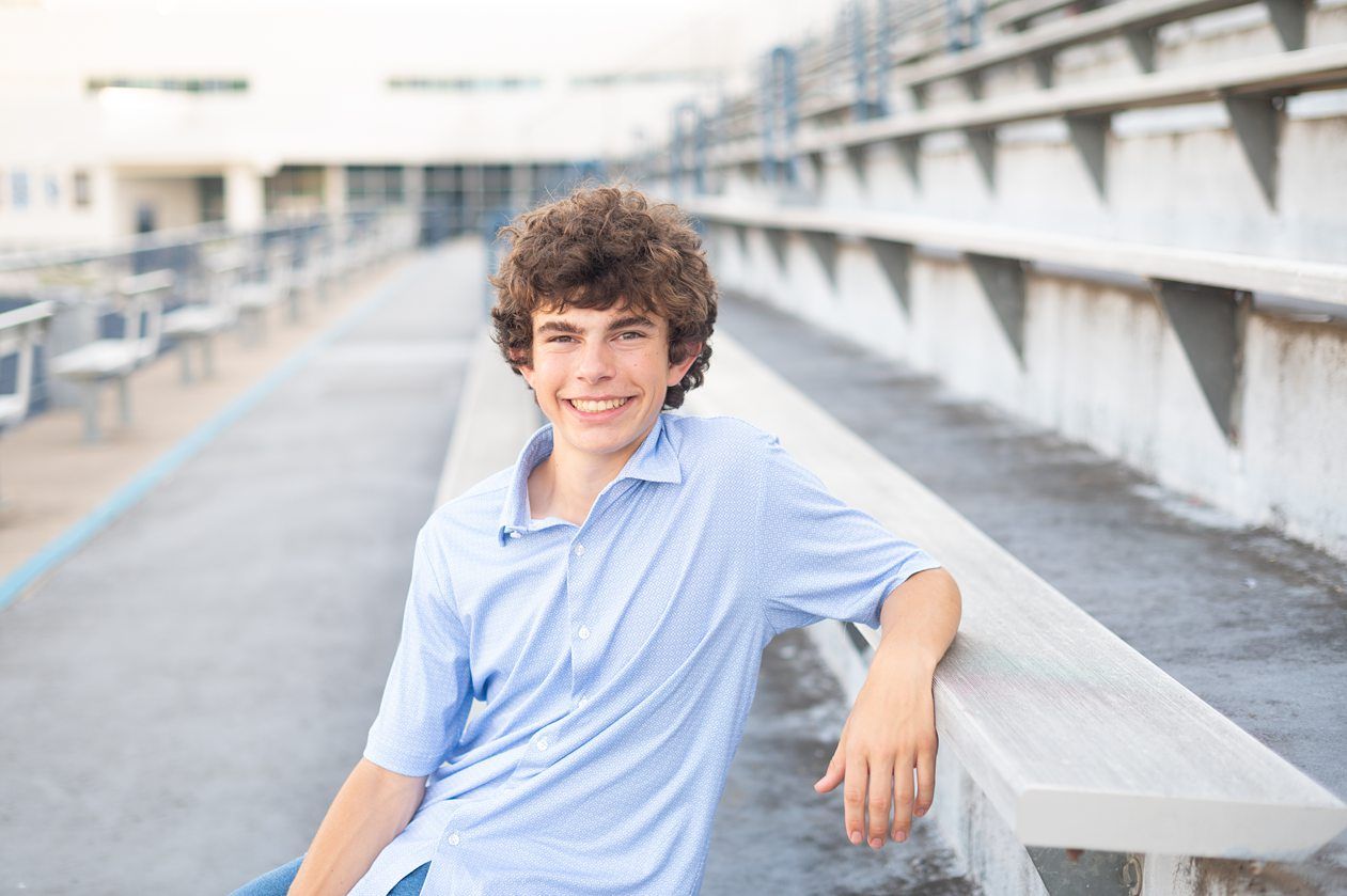 Senior Guy at Bartlesville High School BHS and Downtown by Bartlesville Senior Photographer Kristi Bray Photography
