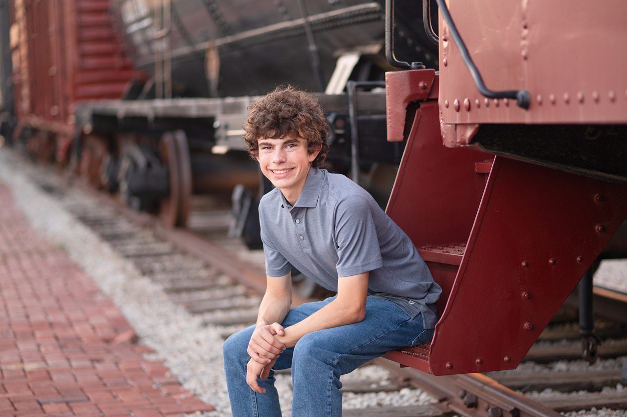 Senior Guy at Bartlesville High School BHS and Downtown by Bartlesville Senior Photographer Kristi Bray Photography