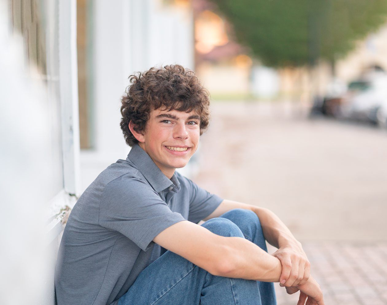 Senior Guy at Bartlesville High School BHS and Downtown by Bartlesville Senior Photographer Kristi Bray Photography